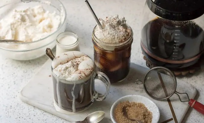 Two glasses of coffee with whipped cream
